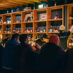 a crowd of people at a bar