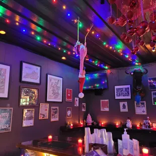 a bar decorated with christmas lights