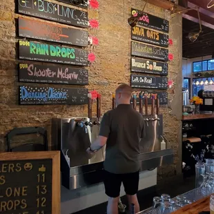 a man pouring a beer