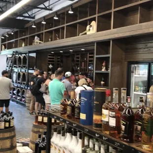 people in a liquor store