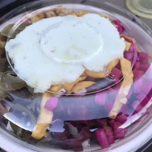 a plate of food with a fried egg on top