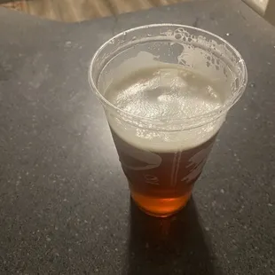 a beer in a plastic cup