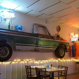 a car hanging on the wall