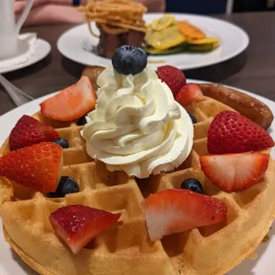 Waffle with sausage up front, braised ribs in back