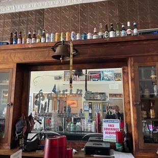 a bar with a television on the wall