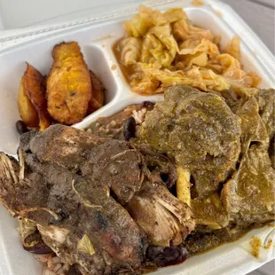 Jerk chicken, goat curry, plantains, rice, beans &amp; cabbage.