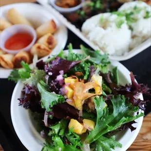 a plate of salad and a bowl of rice