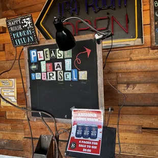 a blackboard with a neon sign