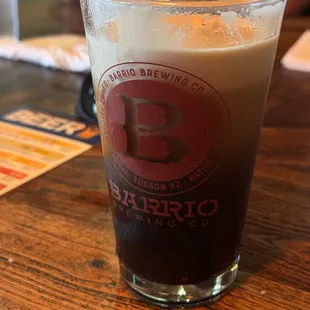 a pint of beer on a table