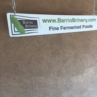 Sign is clearer up front.  Park behind and look for this sign.