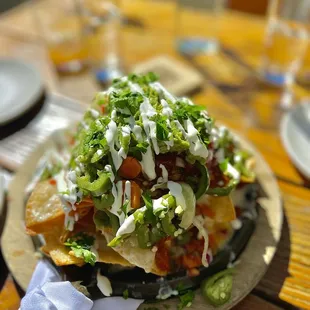 Happy hour nachos with braised chicken