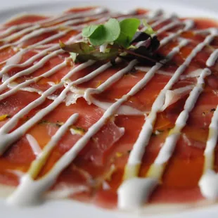 Home Cured Duck Prosciutto rubbed with herbs and zest.