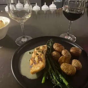 8oz salmon from the grill with crackled potatoes and rapini