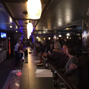 people sitting at a bar