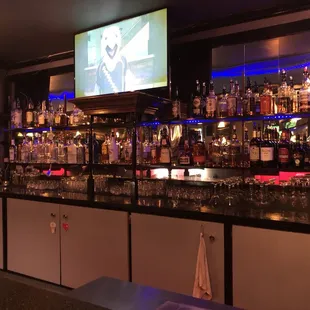 a bar with a lot of liquor bottles
