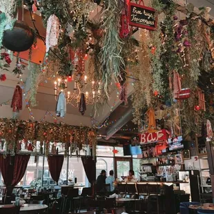 the interior of a restaurant decorated for christmas