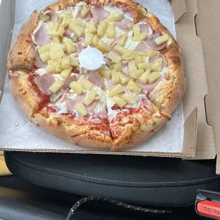 Undercooked!  And did you put the whole can of pineapples on my pizza ?