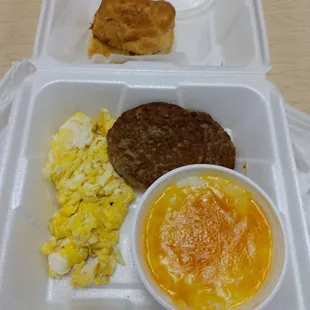 Rise and Shine Biscuit, eggs hard scrambled, grits with cheddar cheese &amp; 2 sausage patties