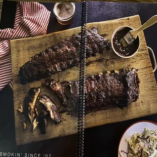 a cookbook with ribs and coleslaw