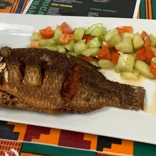 Fried fish with cucumber salad