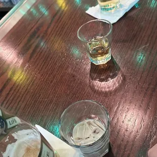 three glasses of beer on a bar