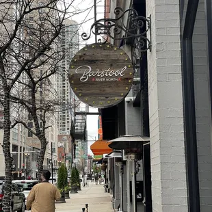 a man walking down a sidewalk