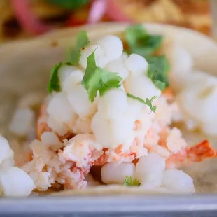 a lobster taco on a tortilla