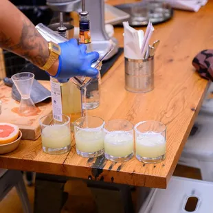 a bartender pouring a drink