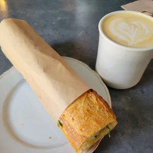 Egg, arugula, aioli sandwich and regular latte