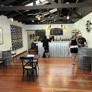 two people standing in the tasting room