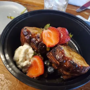 Bread pudding. It was delicious but the picture isn&apos;t great because it&apos;s in a carry-out container.