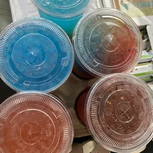 a variety of plastic containers with lids
