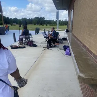 a group of people sitting in lawn chairs