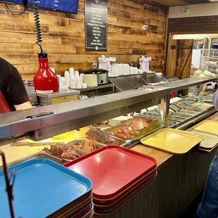 ows a man standing in front of the counter