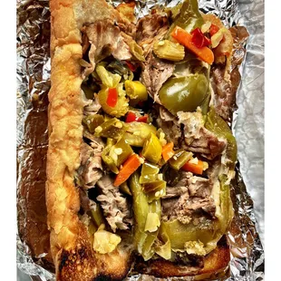 Italian Beef Sandwich! Chicago Classic!Slices of Juicy Beef On Toasted French Bread Sweet Peppers &amp; Hot Giardiniera and Mozzarella Cheese.