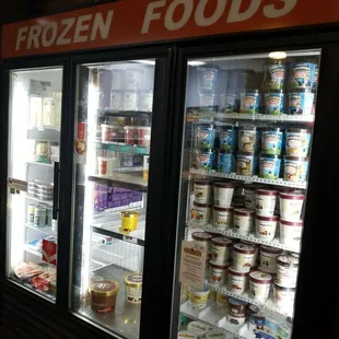 a frozen food section in a grocery store