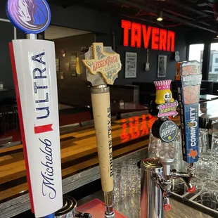 a row of beer taps
