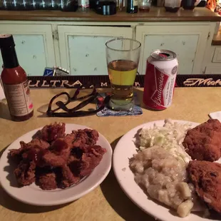 Chicken livers, fried thighs with German style slaw and potato salad. Delicious