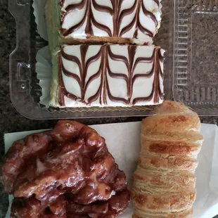 2 Napoleons, an apple fritter and a cream horn.