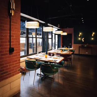 a dining room with a brick wall