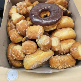 Assorted dozen donuts with some extras