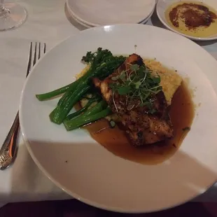 glazed salmon special with cheesy grits and broccolini