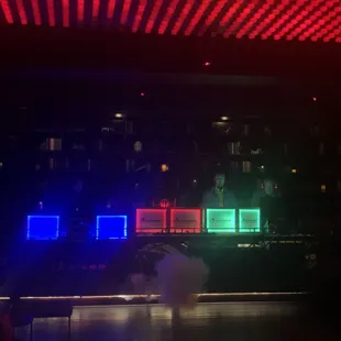 a bar with neon lights in the background