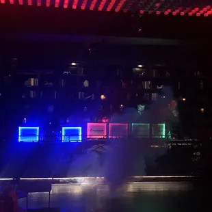 a stage with red, white, and blue lights