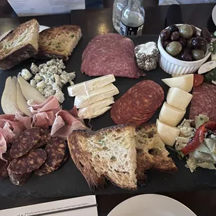 a platter of meats and cheeses