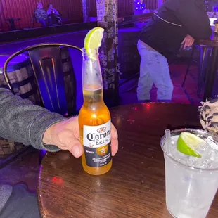 Corona with lime and a double Tito's and soda