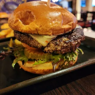 Burger wagyu with jalapenos spring mix pickles onion and pepper jack cheese with garlic sauce. Next time adding bacon and avocado.