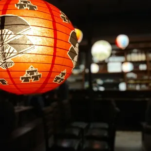 a red paper lantern hanging from the ceiling
