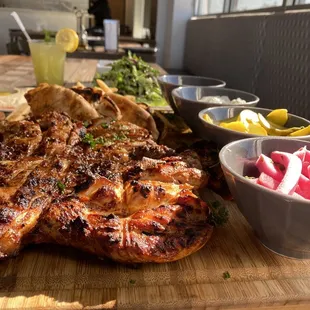 a wooden cutting board with a variety of foods on it