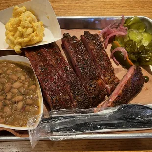 Pork ribs with beans and mac n cheese.